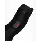 Black sheepskin-lined anatomic jumping girth cover black with sleek padding and subtle red branding for jumping use