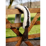 Black leather anatomic jumping girth cover natural with white fleece lining and adjustable straps for jumping girth