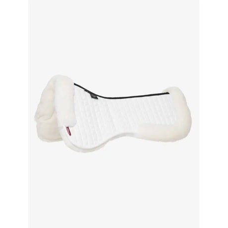 White sheepskin lemieux merino+ dressage half pad with plush texture and black trim in half pad white color