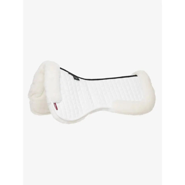 White sheepskin lemieux merino+ dressage half pad with plush texture and black trim in half pad white color
