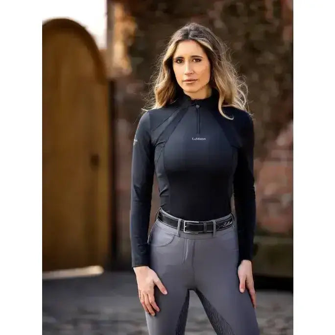 Black lemieux mia mesh long sleeve base layer with quarter zip and subtle paneling featuring lemieux logo on chest