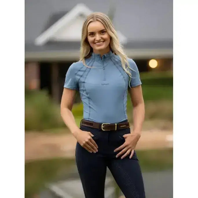 Light blue lemieux mia mesh short sleeve base layer ice blue with quarter zip collar and subtle paneling