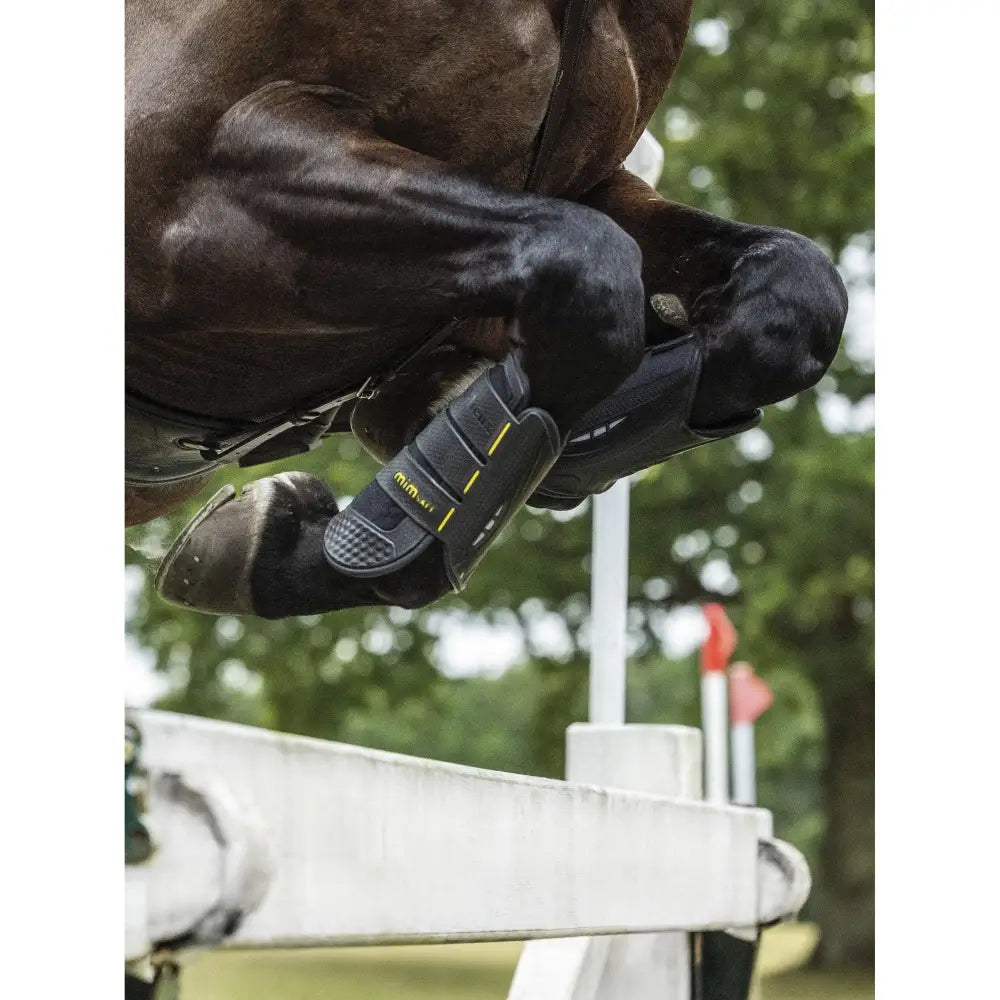 Black and yellow lemieux mimsafe xc boot front made of durable synthetic material with textured grip for leg protection