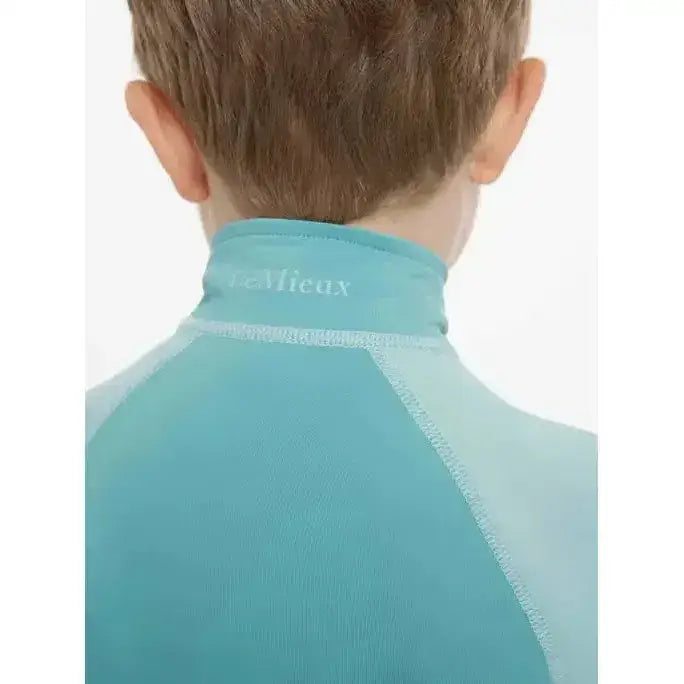 Teal lemieux mini base high neck base layer lagoon with ribbed texture and mieux logo embroidered on collar