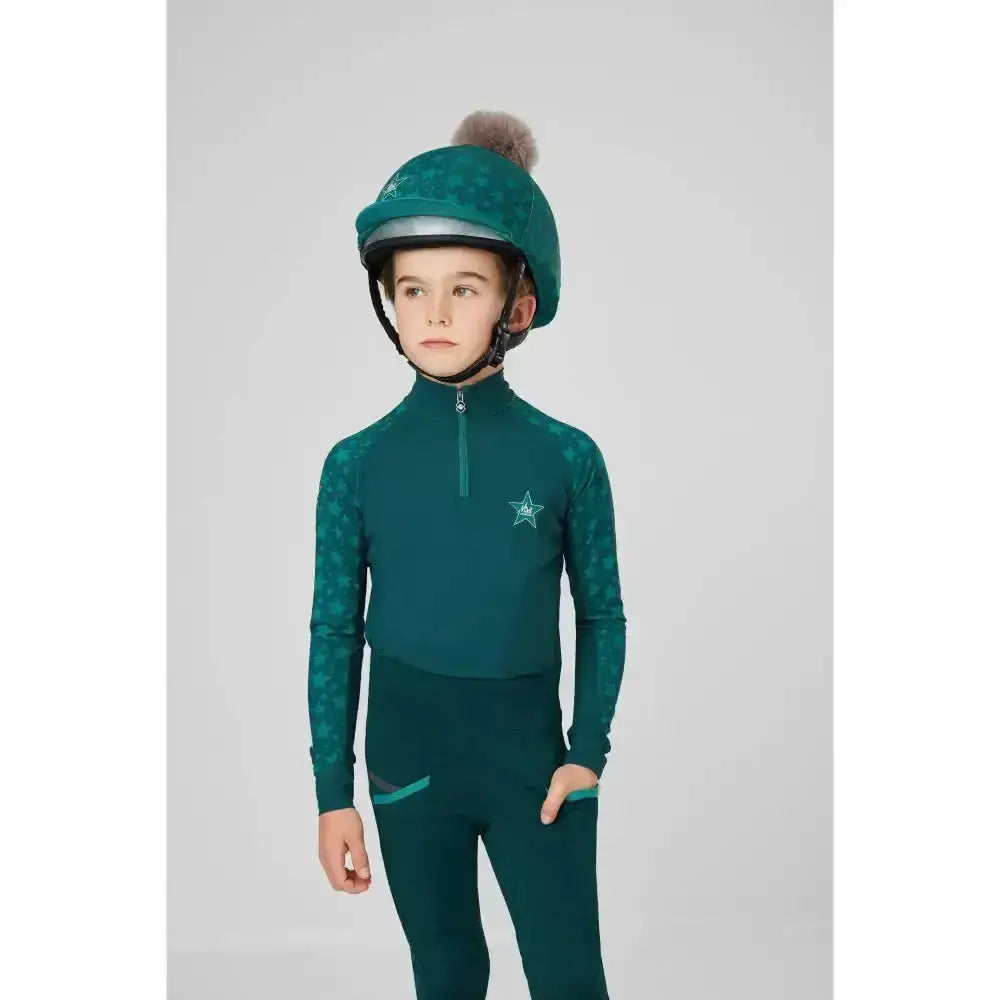 Teal lemieux mini base equestrian helmet with fuzzy pom-pom on top for mini riders running and base layer spruce use