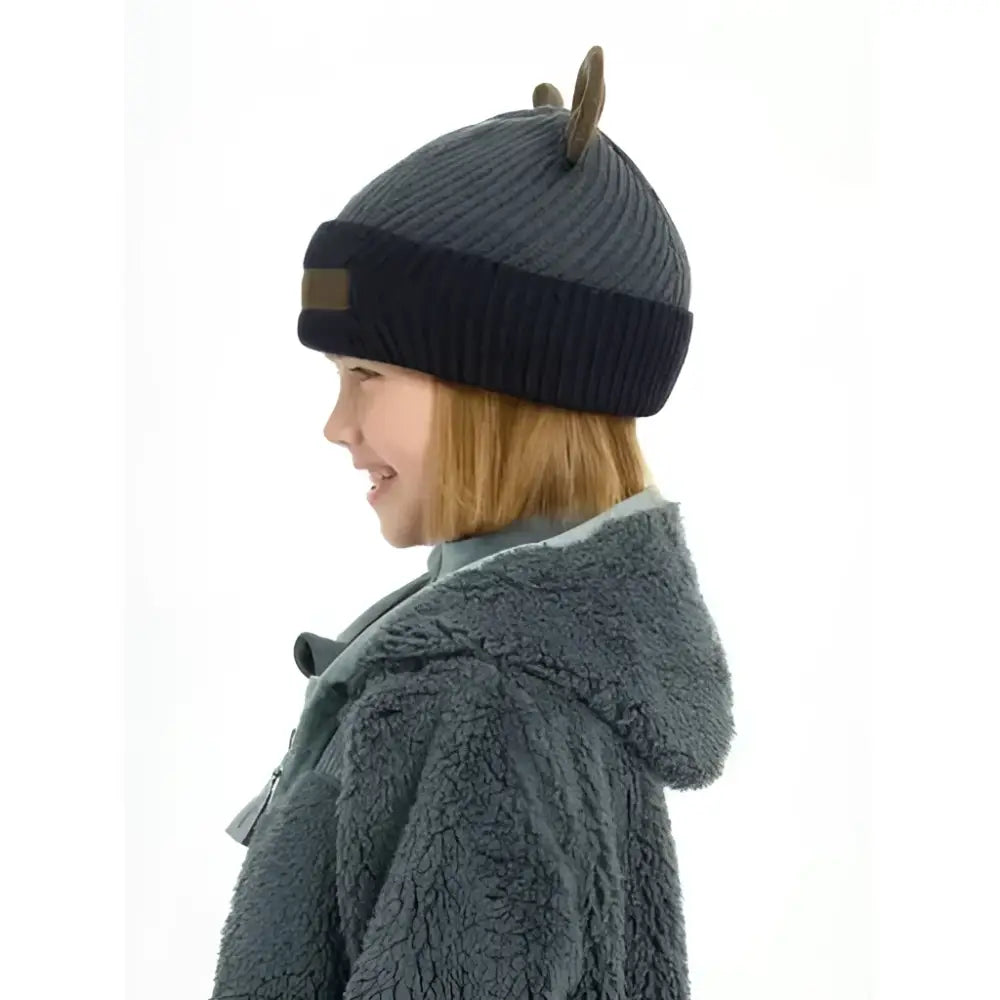 Gray knitted lemieux mini bear beanie petrol with dark blue ribbed brim and brown horn-like embellishments