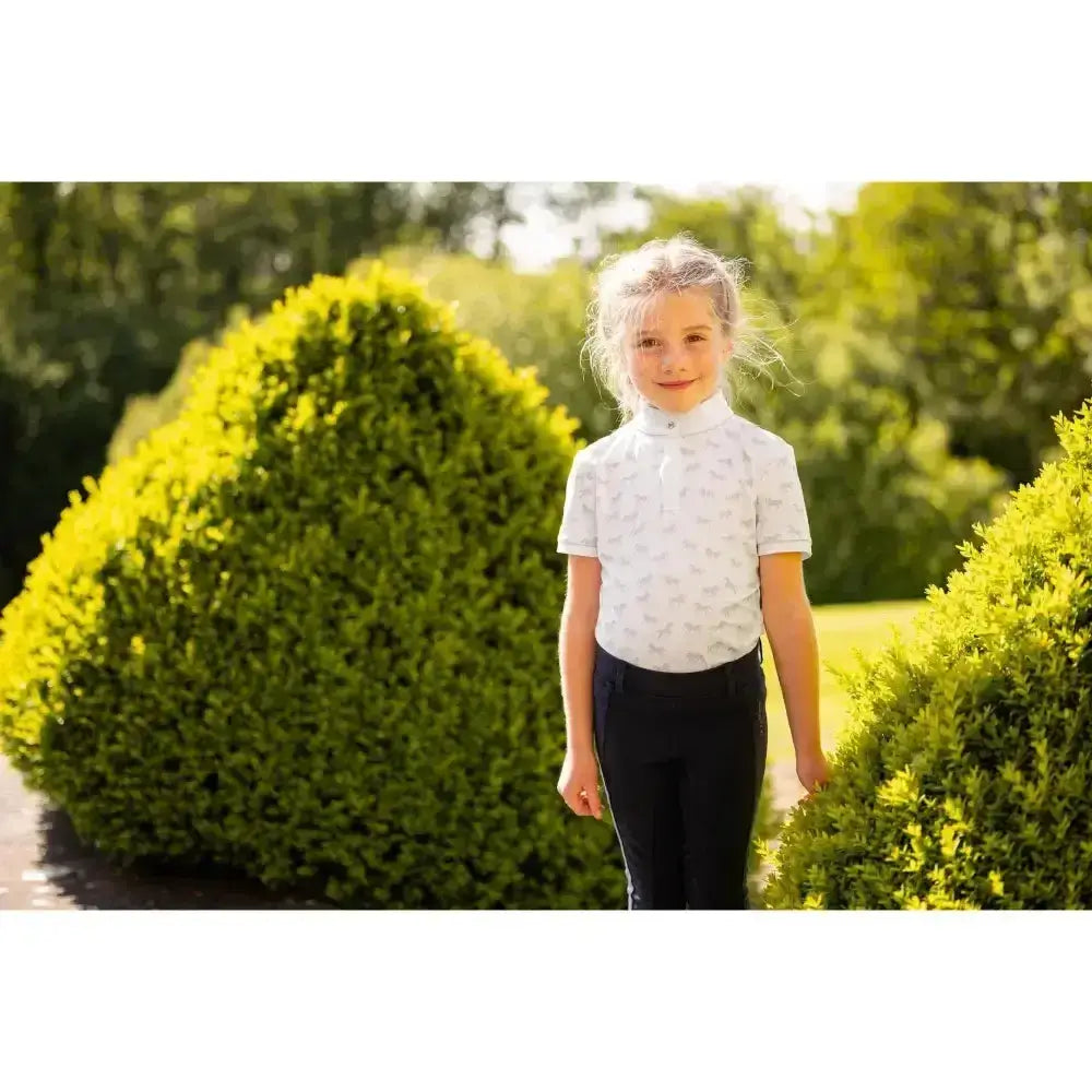 White lemieux mini bella short-sleeved equestrian shirt with subtle gray pattern and high collar perfect competition wear