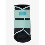 A sleek black and mint green lemieux mini brushing boot with adjustable straps from brushing boots aqua line
