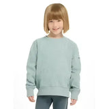 A child wearing a soft light blue knit lemieux mini casey crew sweatshirt with ribbed cuffs and hem