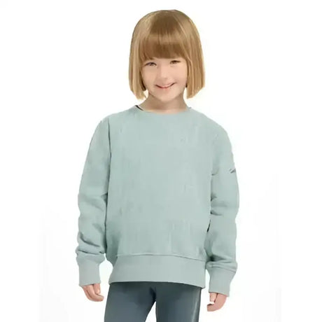 A child wearing a soft light blue knit lemieux mini casey crew sweatshirt with ribbed cuffs and hem