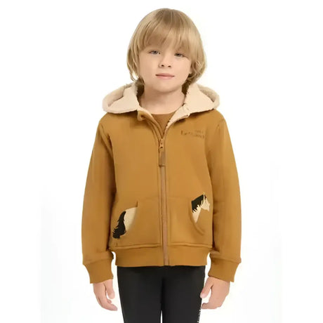 A child wearing a lemieux mini charlie super snuggly lined hoodie ginger with beige plush hood and paw print pockets
