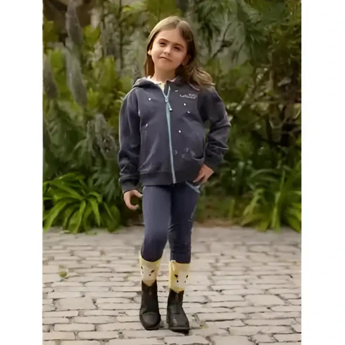 Young girl wearing lemieux mini charlie zip dusk blue dark blue hoodie with star embroidery and matching leggings
