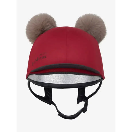 Red lemieux mini double pom hat silk ember with tan faux fur pom-poms and reflective silver lining on equestrian helmet cover