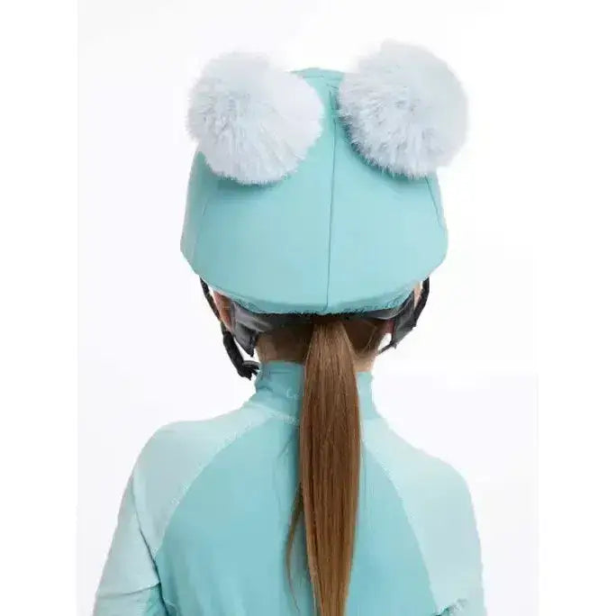 Mint green lemieux mini double pom hat with two fluffy white pom poms in soft silk lagoon fabric