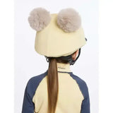 Cream-colored lemieux mini double pom hat silk mimosa equestrian helmet with two fluffy gray pom-poms on top