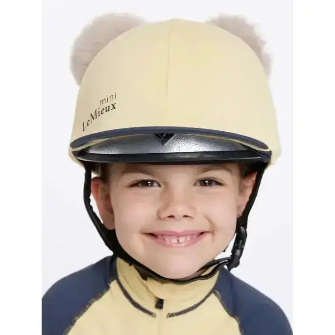 Cream-colored lemieux mini double pom hat silk mimosa with plush fuzzy bear ears for equestrian use