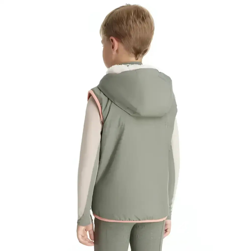 A child wearing a lemieux mini george gilet rosemary gray hooded vest with pink trim and white inner lining