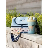 Light blue insulated lemieux mini holdall aqua with playful horse pattern and black zippers and handles
