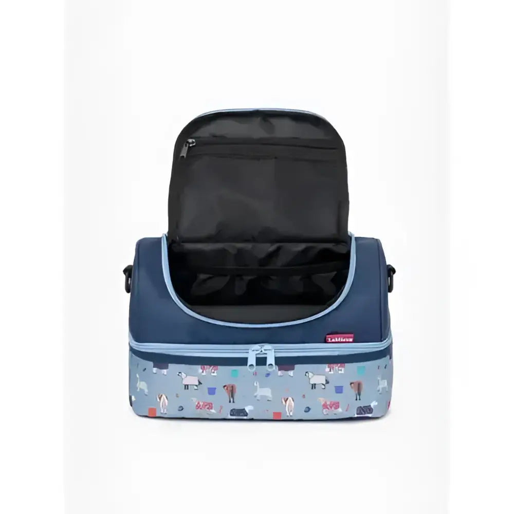 A navy blue and light gray insulated lemieux mini holdall with white dogs red apples and green trees pattern