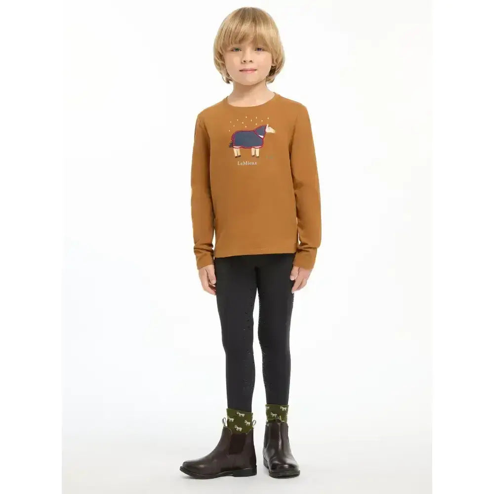 A child wearing a lemieux mini jessie mustard-yellow classic relaxed-fit long-sleeved top with nep cluster-textured fabric and cartoon horse graphic