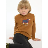 A child wearing a lemieux mini jessie classic relaxed-fit long-sleeved top in ginger with nep cluster-textured fabric and sheep design