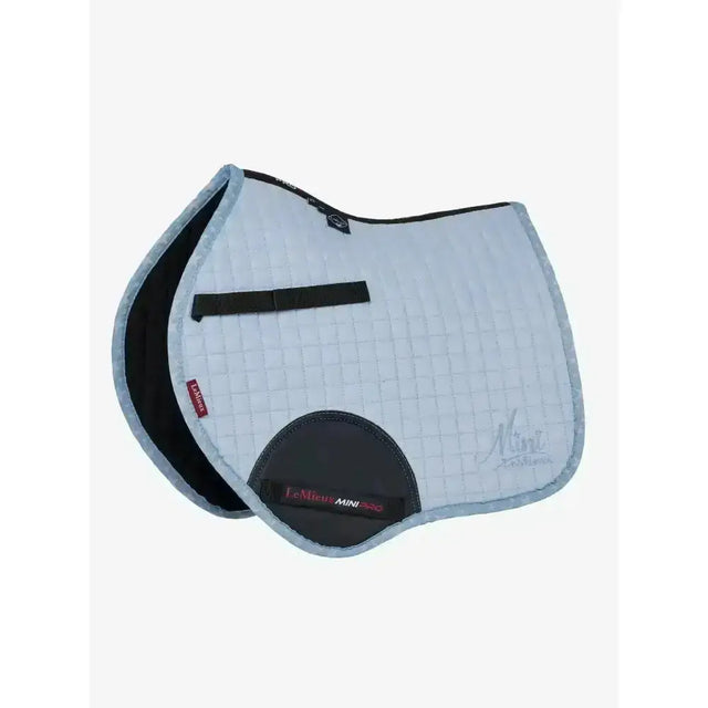 Light blue quilted lemieux mini jump suede saddle pad with black trim and central strap jump suede square design