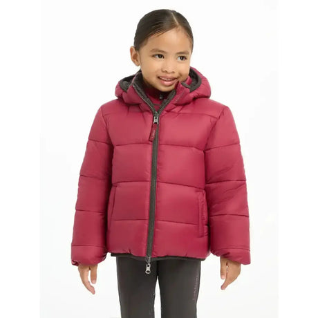 A child wearing a lemieux mini megan reversible puffer ember jacket in maroon with black zipper accents and a hood