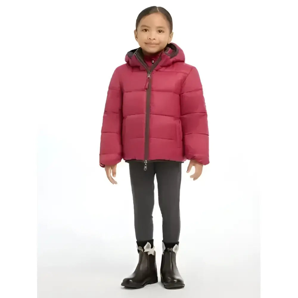 A child wearing a magenta lemieux mini megan reversible puffer ember with quilted design and plaid hood lining