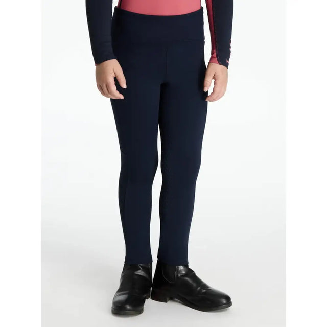 Navy blue lemieux mini nora high-waisted leggings with smooth stretchy fabric and subtle side seam detailing