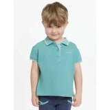 A child wearing a teal lemieux mini polo shirt lagoon with white trim and star buttons on collar and sleeve cuffs