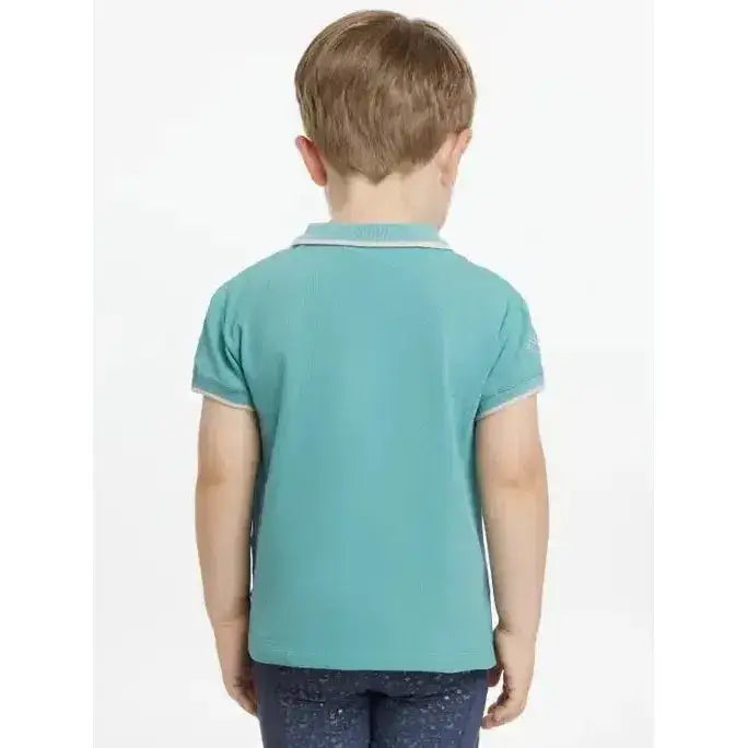 A child wearing a lemieux mini polo shirt lagoon in teal with white trim and star buttons on collar and cuffs