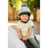 Light green lemieux mini pom equestrian helmet with gray star pattern and fluffy gray pom pom in hat silk fern design