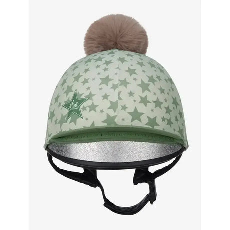 A mint green lemieux mini pom equestrian helmet cover with star patterns fluffy brown pompom and silver glitter lining
