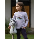 A plush gray and white stuffed llama toy with black stitching next to a lemieux mini poppy long sleeve top lilac