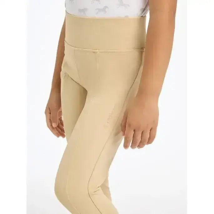 Beige lemieux mini pull breech with smooth 4-way stretch fabric and subtle seam detailing in high-waisted style