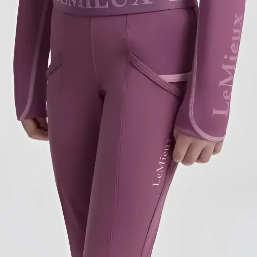 Purple lemieux mini pull breech mallow leggings with matching long sleeve top featuring 4-way stretch fabric and subtle branding