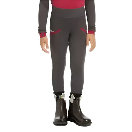Dark gray lemieux mini pull ons with red side pocket accents paired with black cinder active riders boots with white stars
