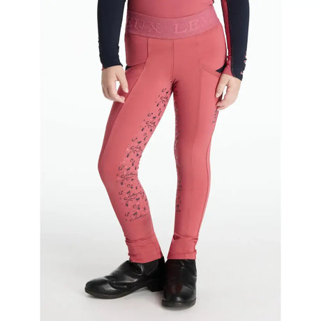 Coral pink lemieux mini pull performance leggings with black horseshoe pattern and embossed branding mini pull ons cranberry