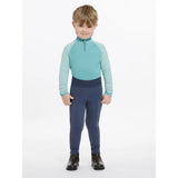 A child wearing lemieux mini pull ons dusk blue performance riding outfit with long sleeves and fitted pants