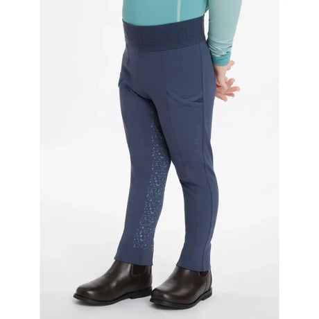 Navy blue lemieux mini pull ons with subtle patterned detailing on the outer leg for performance riding