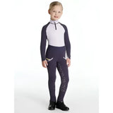 A child wearing navy and white lemieux mini pull ons juniper with silver glitter detailing on the legs for mini riders