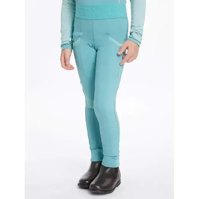 A pair of teal lemieux mini pull ons lagoon leggings with a matching waistband and subtle side pockets