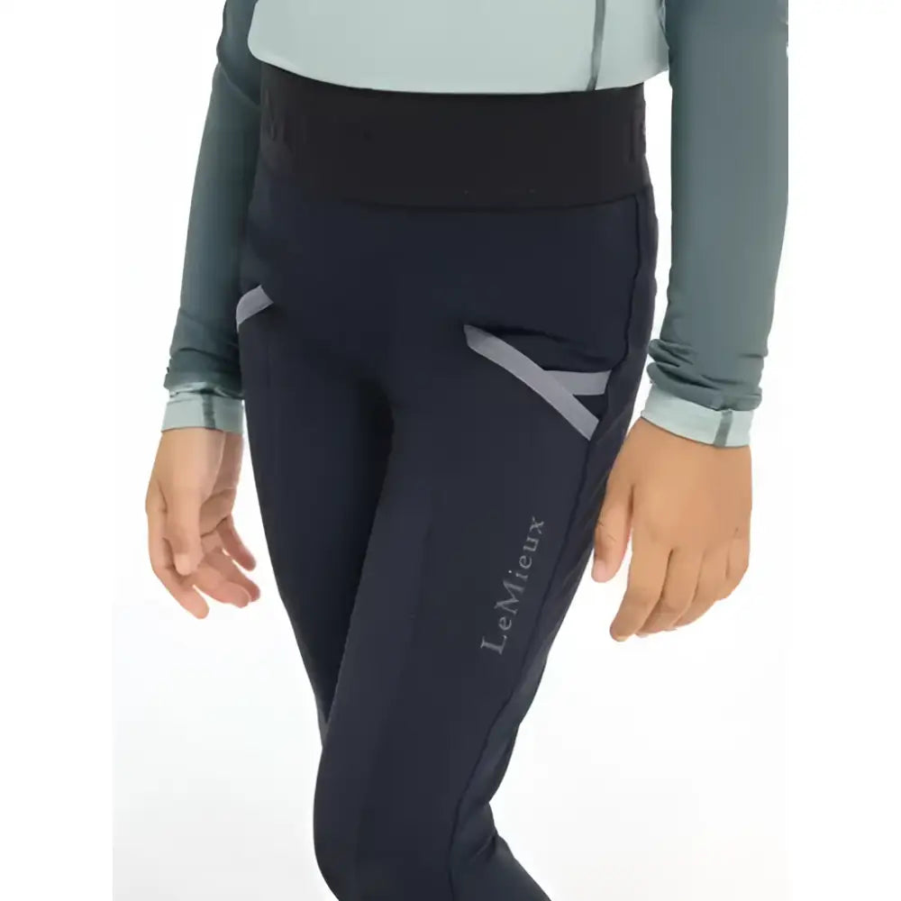 Navy blue lemieux mini pull riding pants with gray accents and high waistband perfect for saddle wearing
