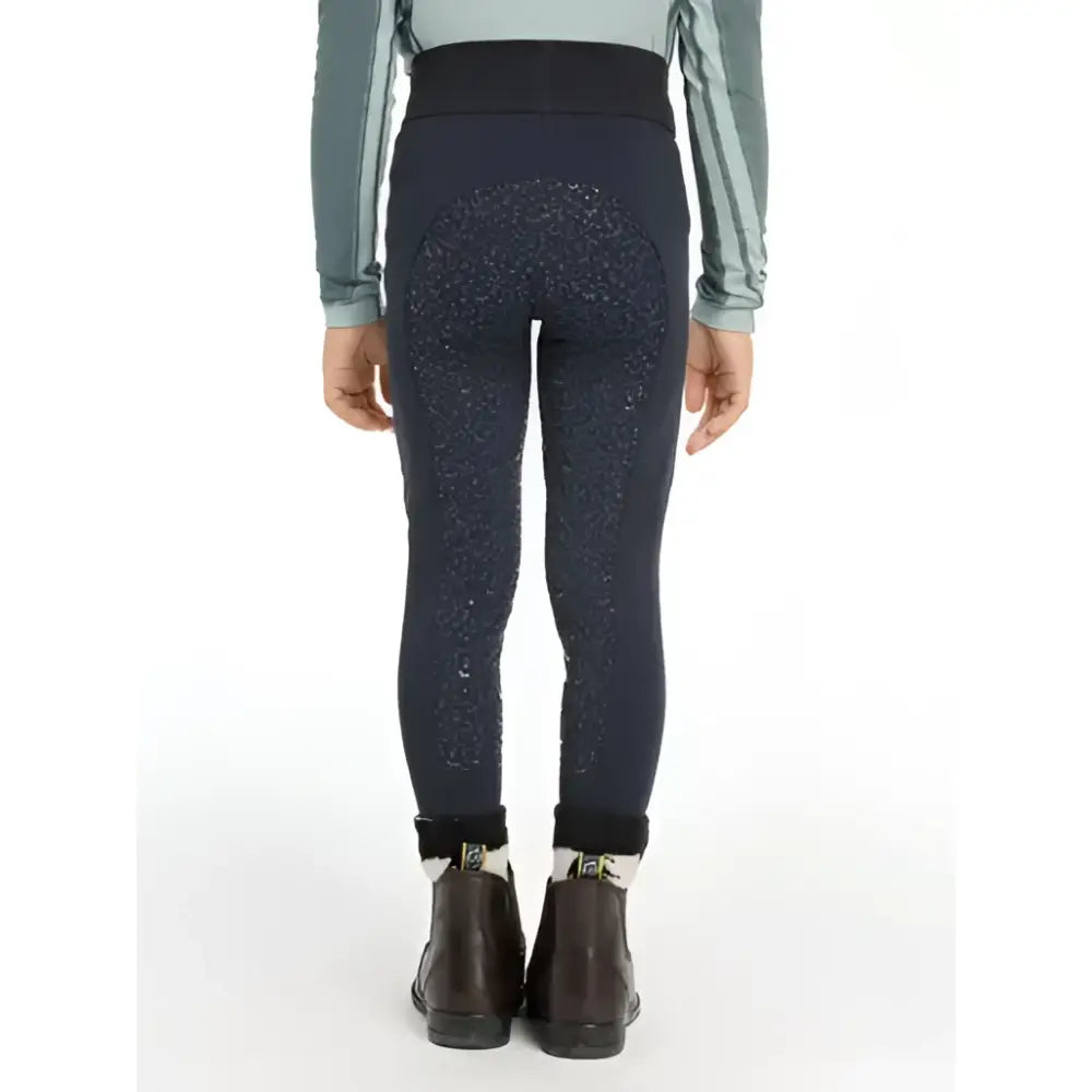 Back view of navy lemieux mini pull equestrian leggings with sparkling pattern and elastic waistband for mini riders saddle wearing