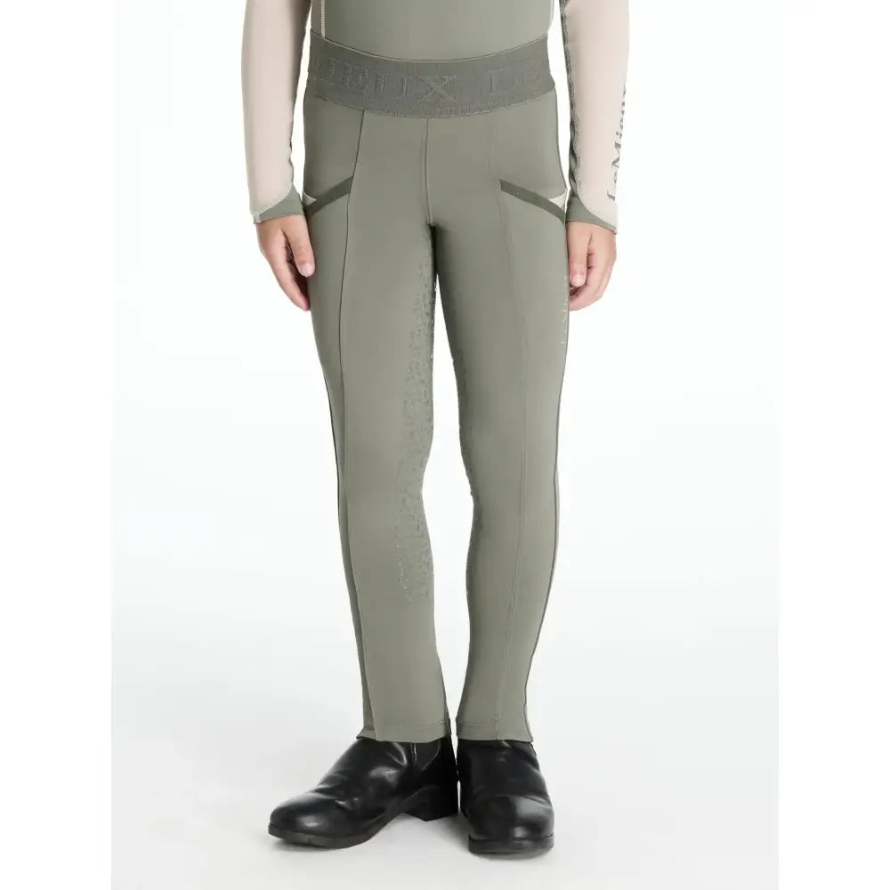 Olive green lemieux mini pull performance riding pants with gray waistband and subtle side seam detailing