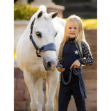 Navy blue lemieux mini reflective base layer with fun reflective star pattern and matching braided reins for riding