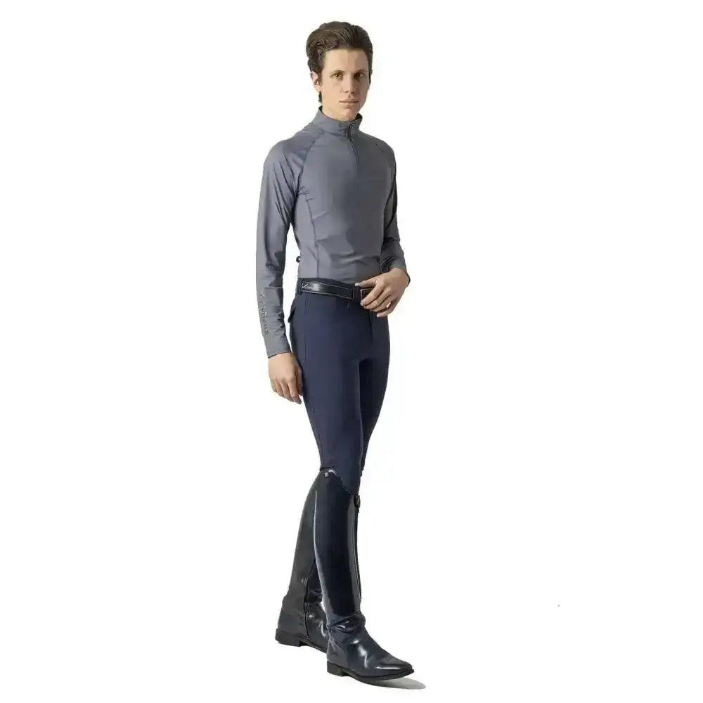 A sleek gray long-sleeved riding shirt with high collar and subtle stitching paired with lemieux monsieur breeches navy
