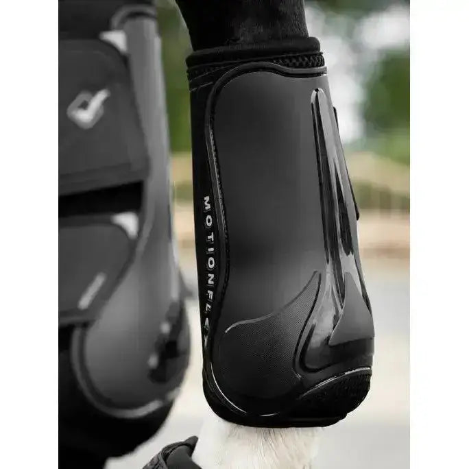 Black glossy lemieux motionflex dressage boot with flexible contoured design and subtle texture for dressage use