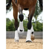 White lemieux motionflex dressage boot with a sleek flexible design and snug fit for horse leg protection