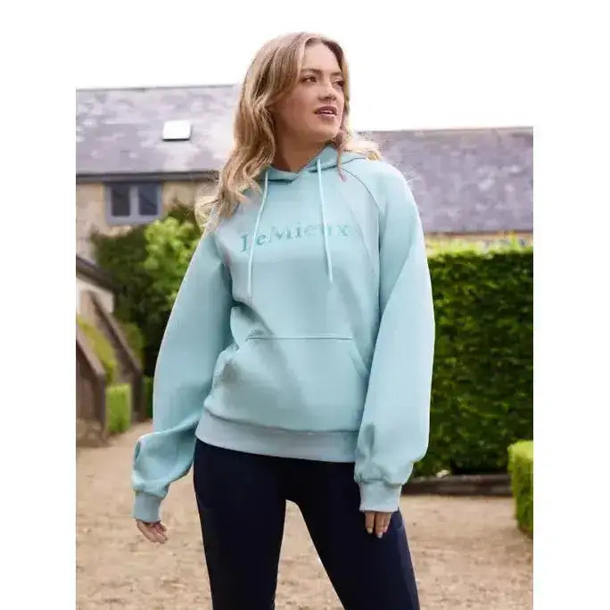 A soft mint green lemieux nadine hoodie aqua with subtle embroidered logo and matching drawstrings for comfy wear
